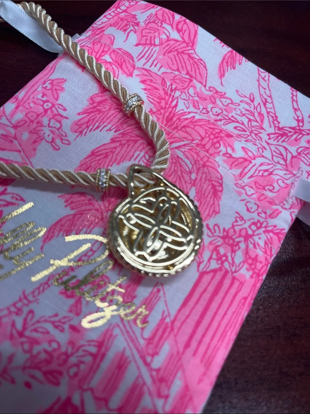 Lilly Pulitzer gold shell with blue stone! Gold cord with accents. Beautiful.